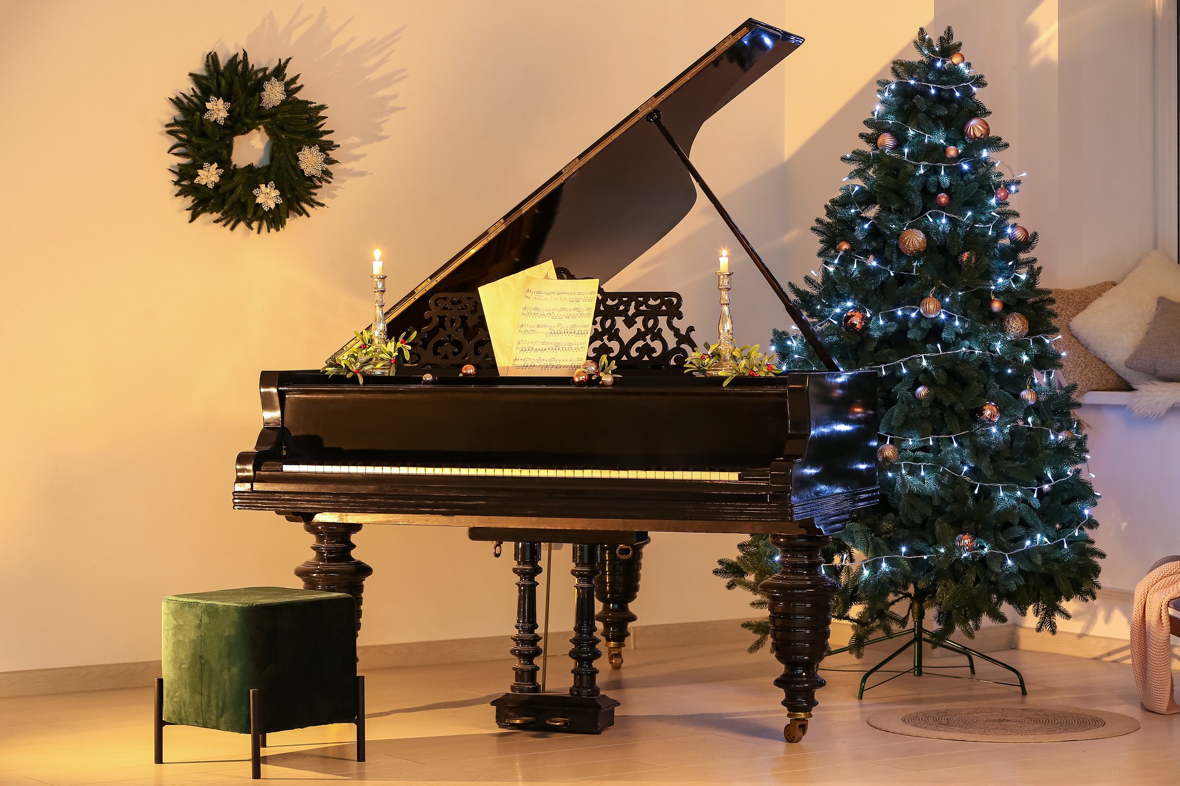 Beautiful Grand Piano with Note Sheets in Room Decorated for Christmas at Evening